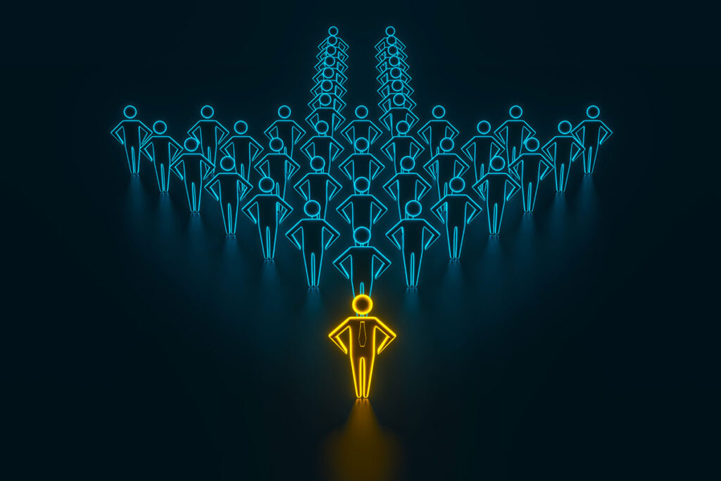 yellow leader figure in front of group of blue figures forming an arrow